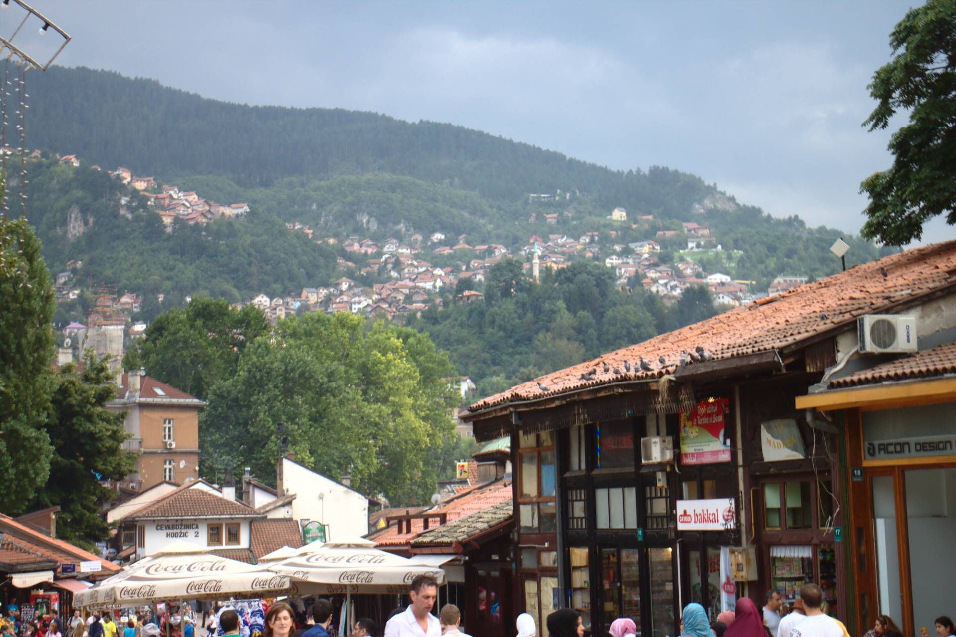 Baščaršija market roofs and the wooded hills of Sarajevo