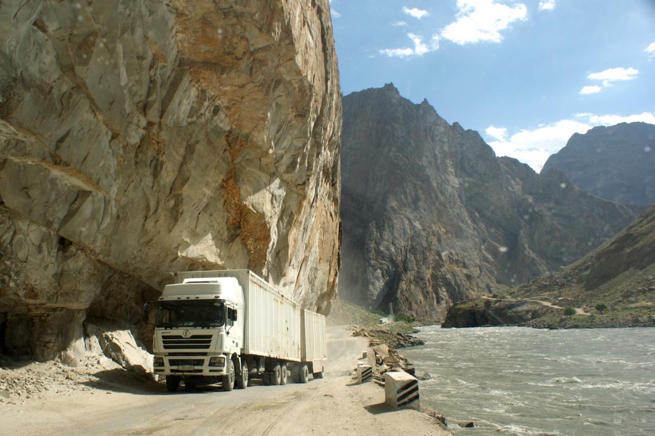 A truck on the narrow Pamir Highway between Qal'ai Khumb and Khorog beside the Panj River